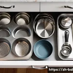 제과제빵 실습 도구 관리 요령 - **Prompt:** A close-up shot in a bright, modern kitchen with warm, inviting natural light. A person'...